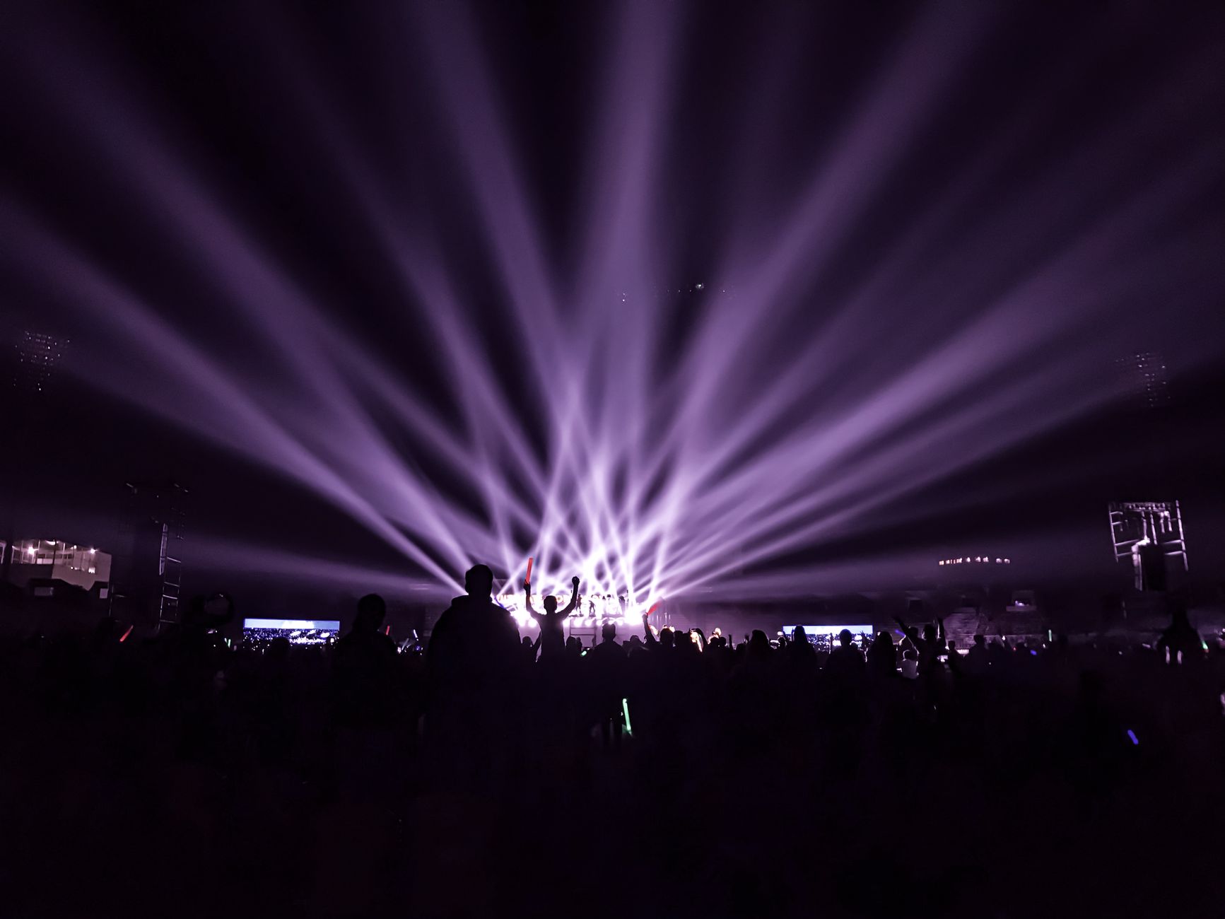 silhouette of people standing on stage